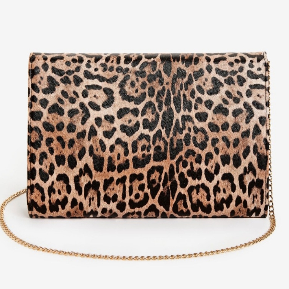 Leopard print shoulder bag with magnetic snap closure.